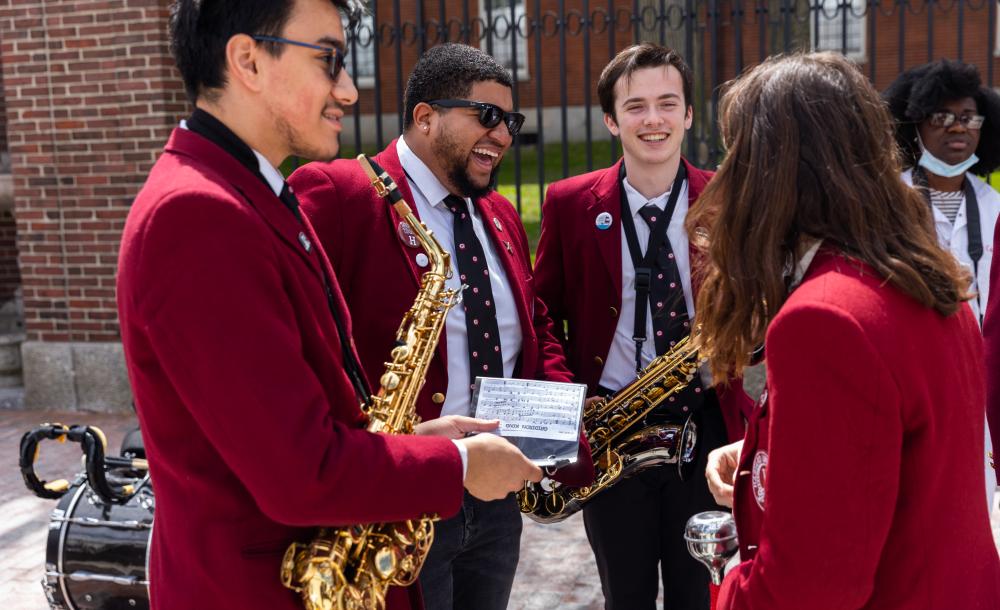 Harvard musicians in band talking to each other at Arts First 2022