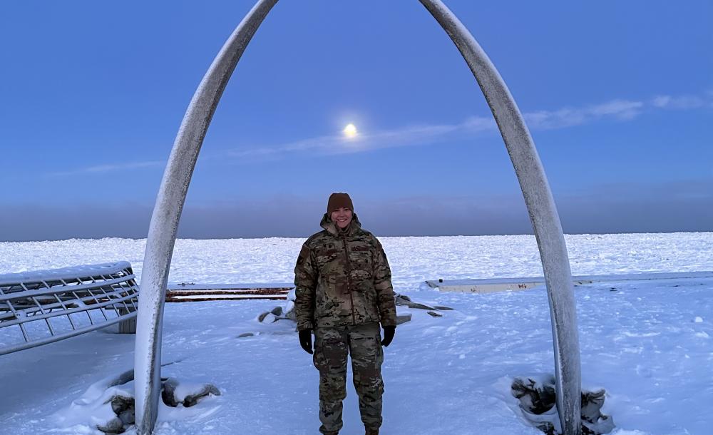 Courtney under and arch in Alaska