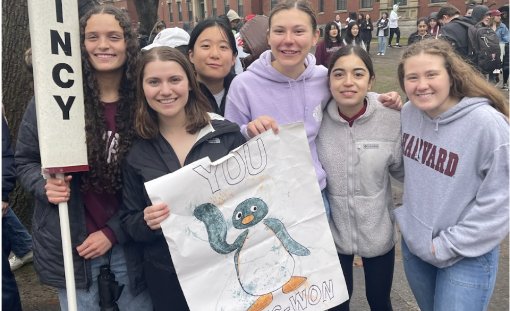 Blocking group posed with Quincy signs 