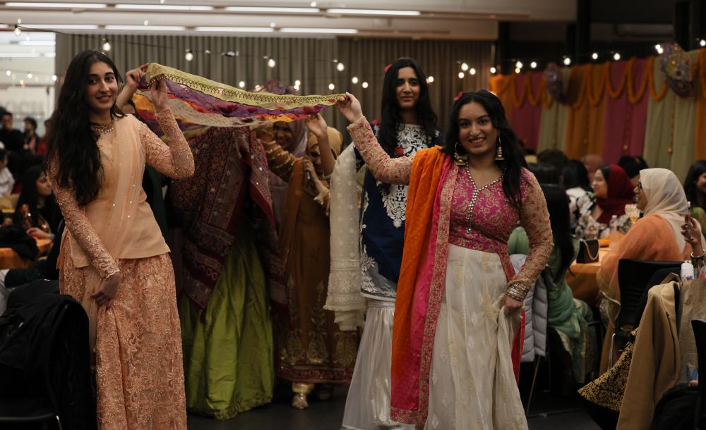 Hana Rehman leading the bride at Mock Mehndi. 