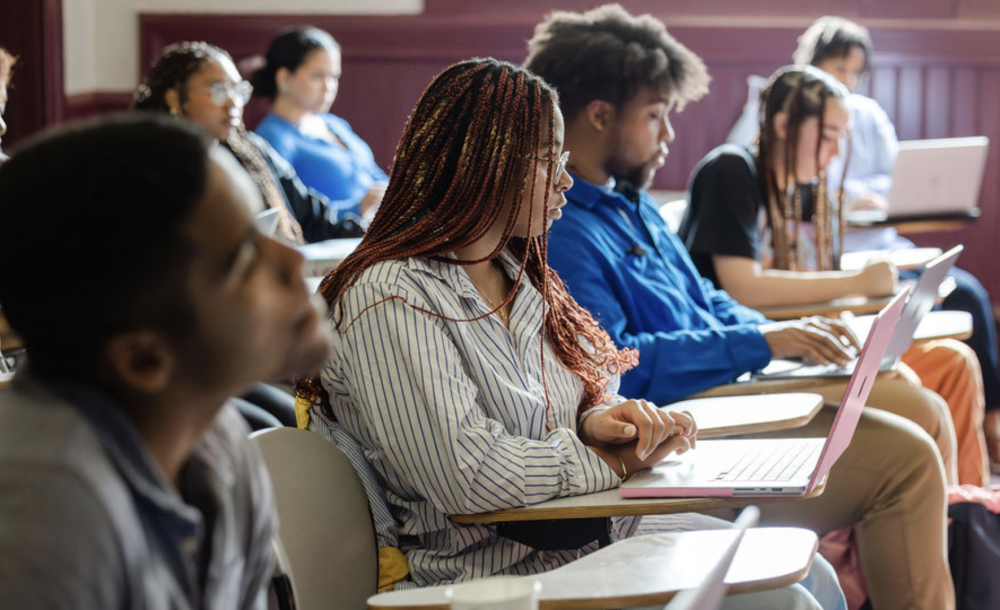 Students taking notes in class