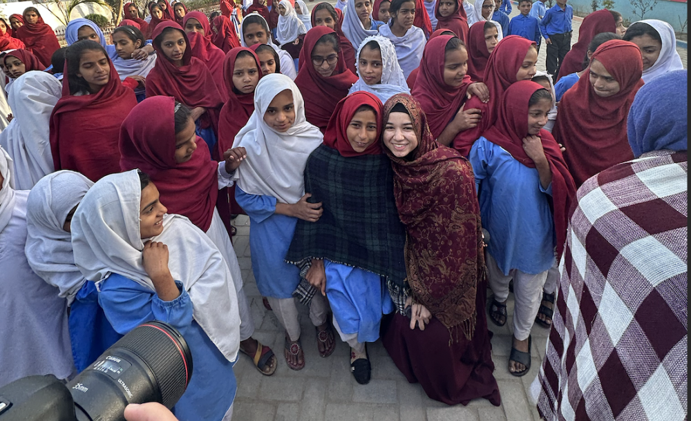 Samia Afrose with students at an all girl's school