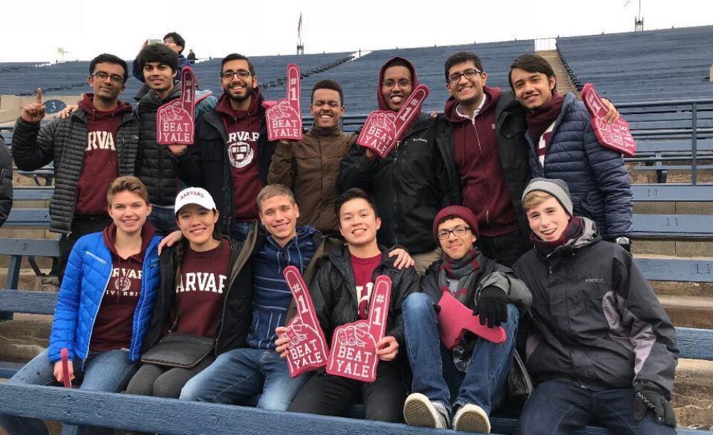 Students cheering at Harvard-Yale football game