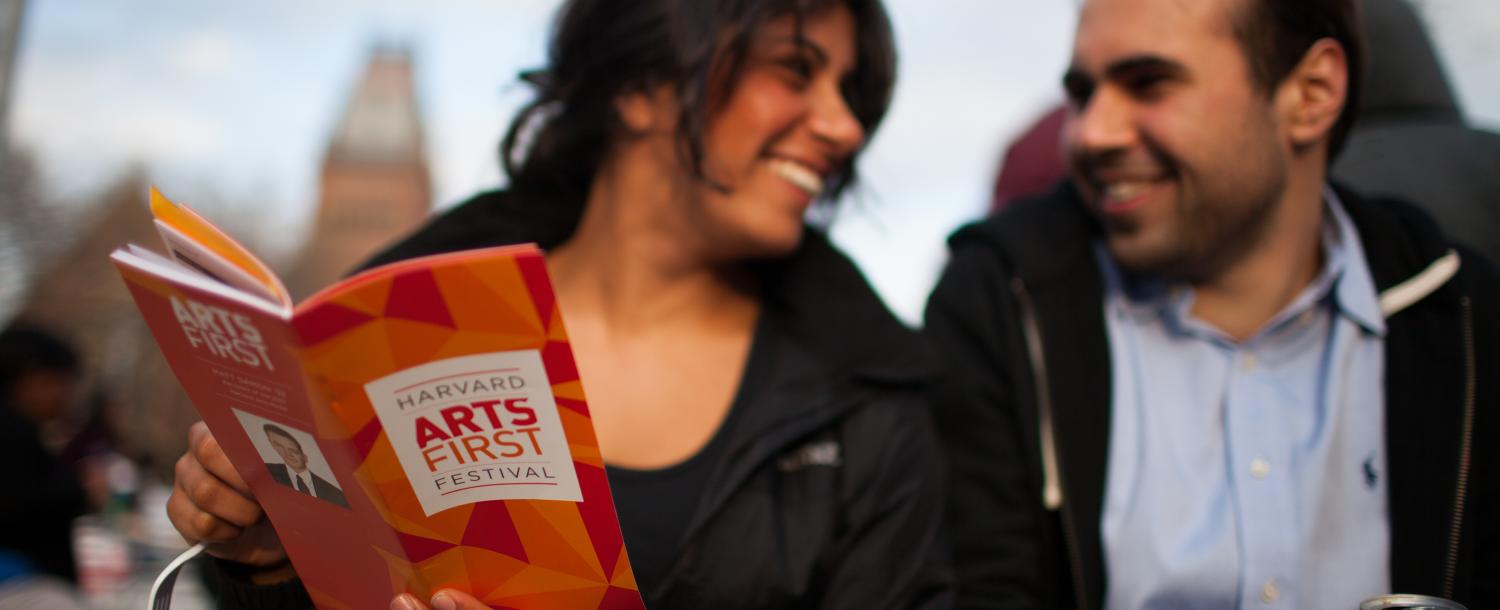 Man and woman looking at ARTS FIRST program