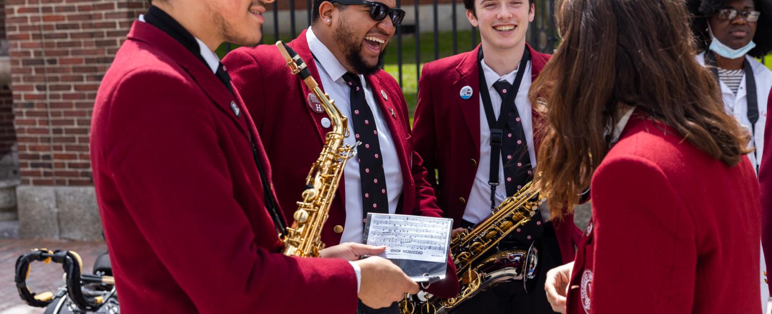 Harvard musicians in band talking to each other at Arts First 2022