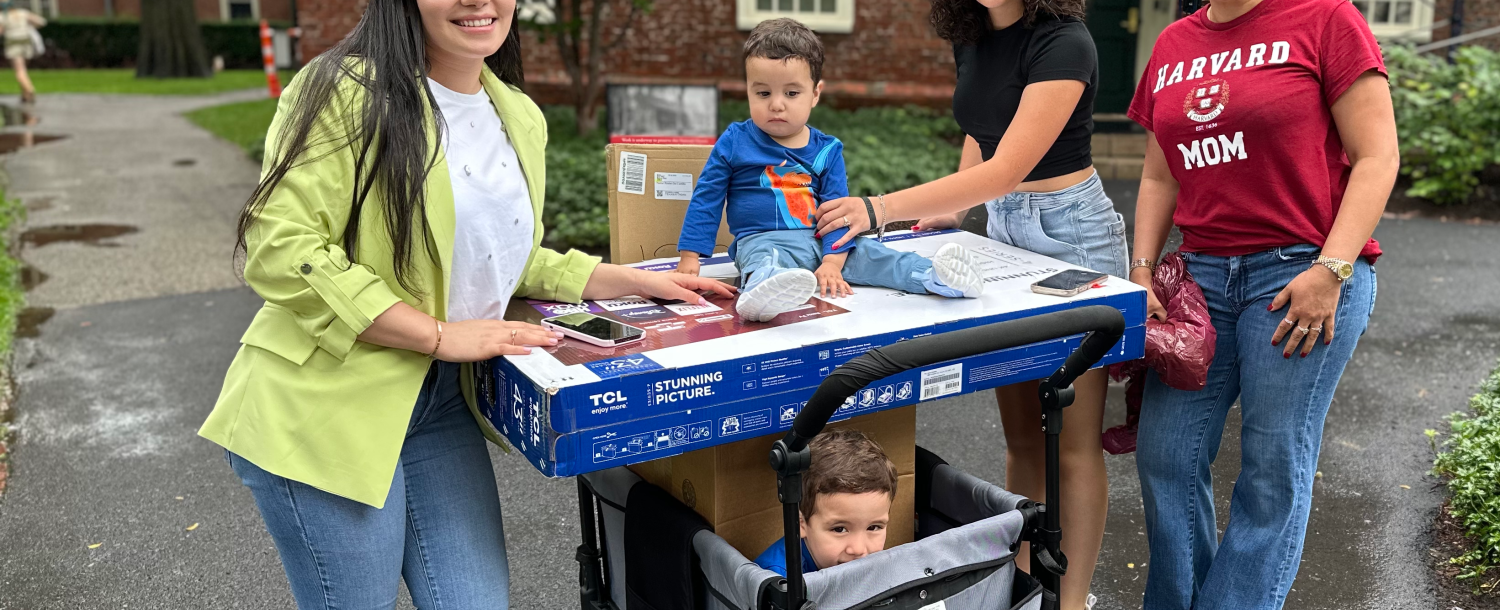 a family helping moving into Harvard