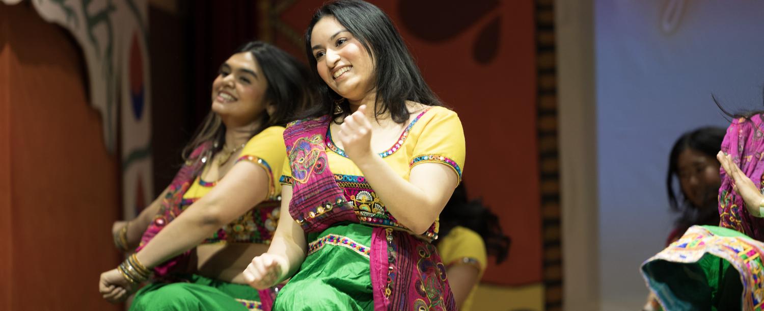 Hana Rehman, co-director of Harvard Ghungroo, the largest student-run production on campus featuring South Asian culture, dancing in her costume for the traditional Garba Raas dance. 