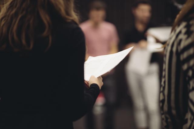 Close up of student holding a piece of paper