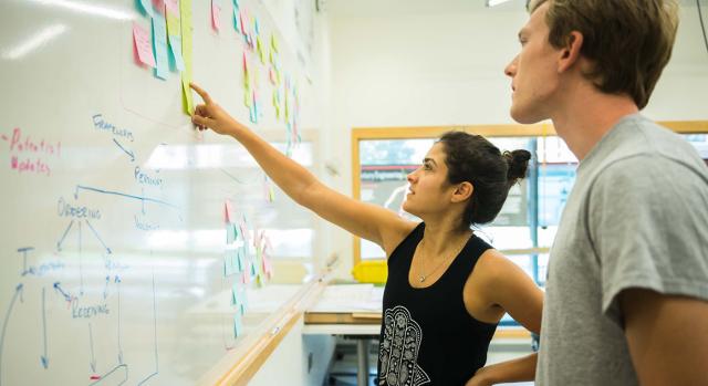 two students in a classroom