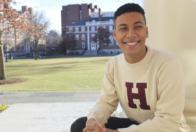 Student sitting in Radcliffe Yard