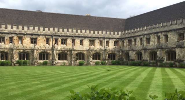 Manicured lawn in front of an old building