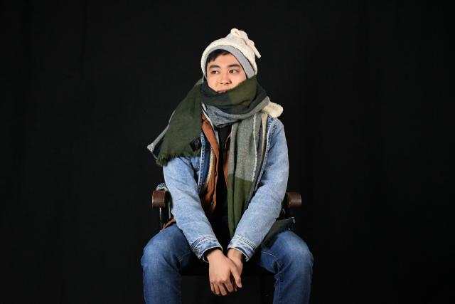 Person wearing many layers of clothing