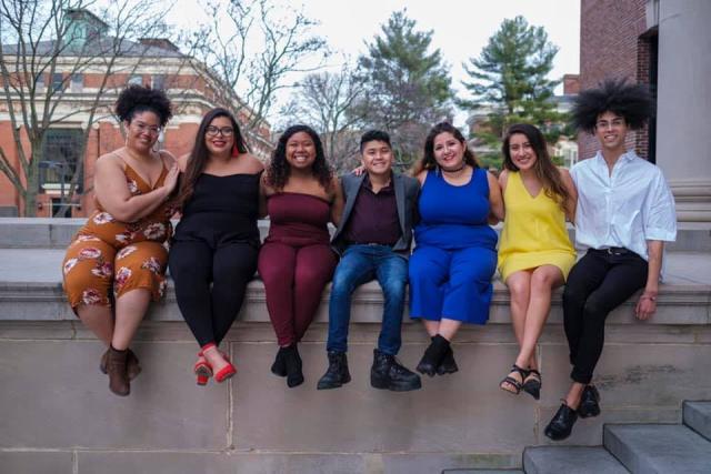 Maribel and friends sit on Widener Library's edge. 