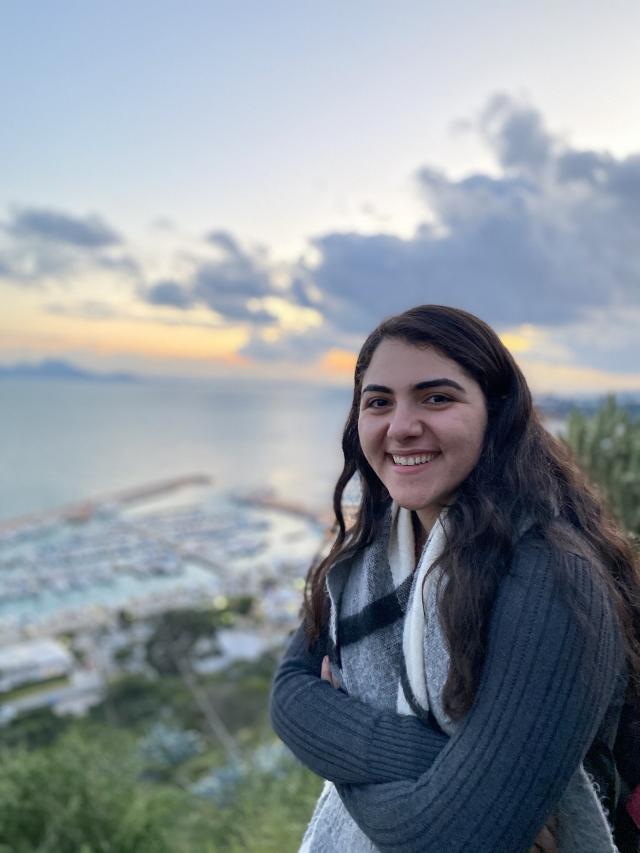 Author on a hill at sunset