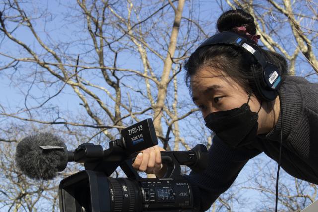 Image of author holding a camera