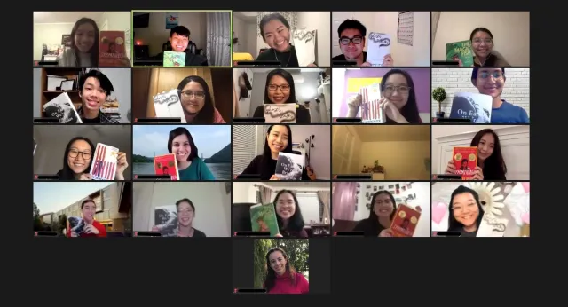 Group of students on Zoom holding up books