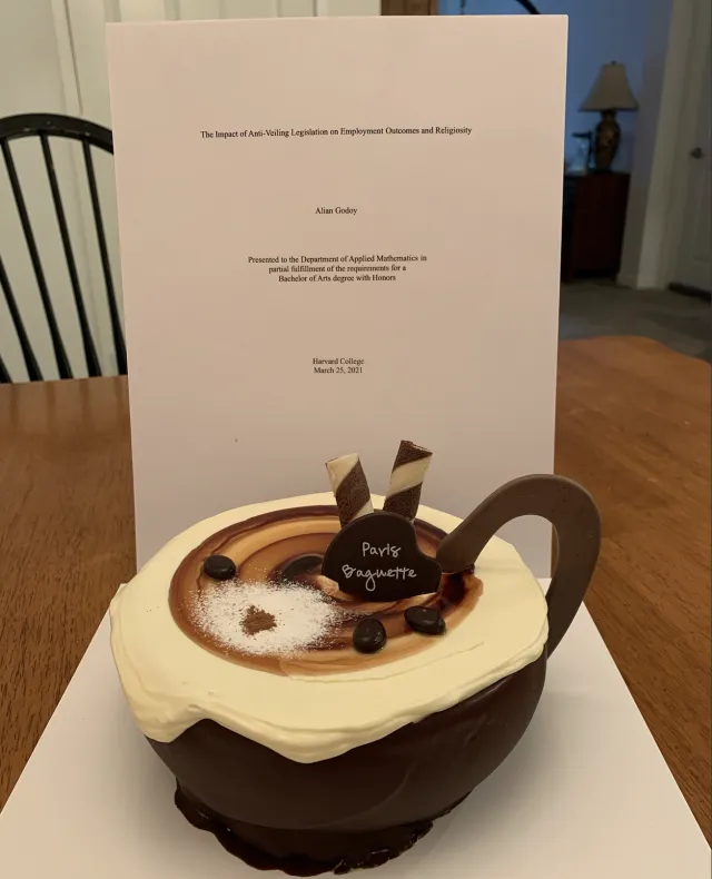 Cake from Paris Baguette in front of  my Thesis Title Page