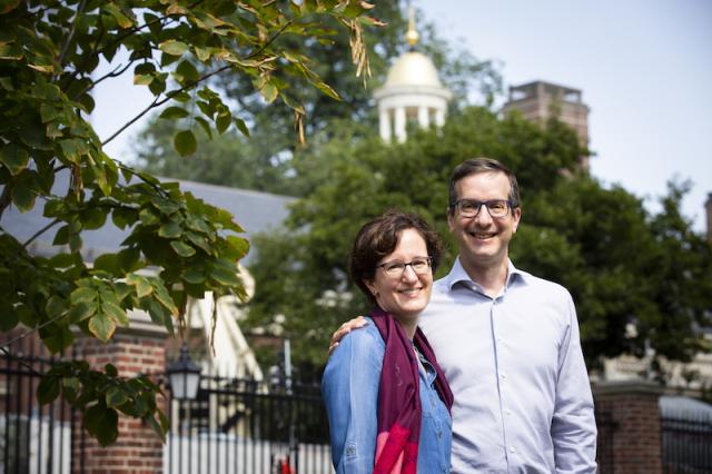 Nina Zipser and David Laibson stand in front of Lowell House