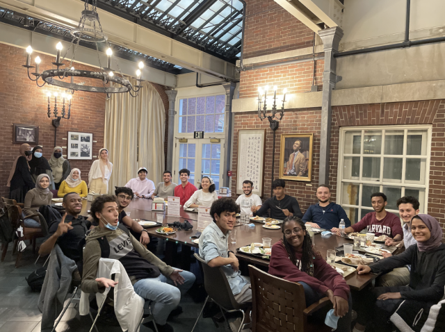 A large group of Muslim students having dinner together