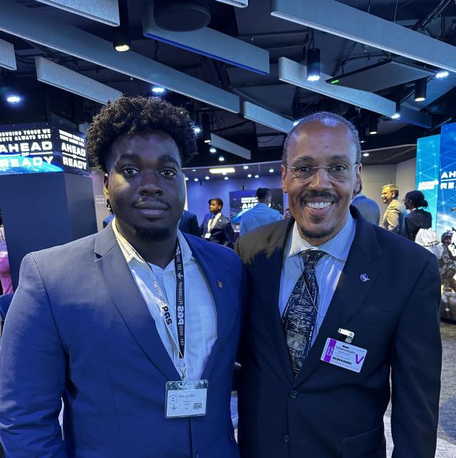 Denzel Ekes and Astronaut Benjamin Alvin Drew pictured together smiling at the camera.