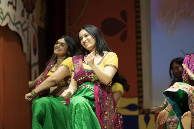Hana Rehman, co-director of Harvard Ghungroo, the largest student-run production on campus featuring South Asian culture, dancing in her costume for the traditional Garba Raas dance. 