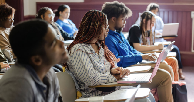 Students taking notes in class