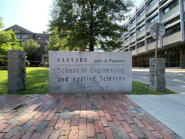 An image of the Harvard John A. Paulson School of Engineering and Applied Sciences sign in front of Pierce Hall. 