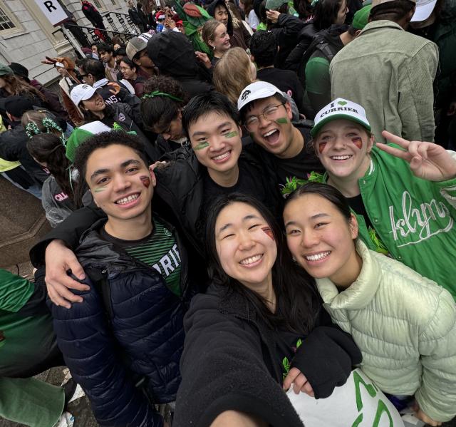 A group picture of the author and his blocking group smiling at the camera in Currier-themed merchandise.