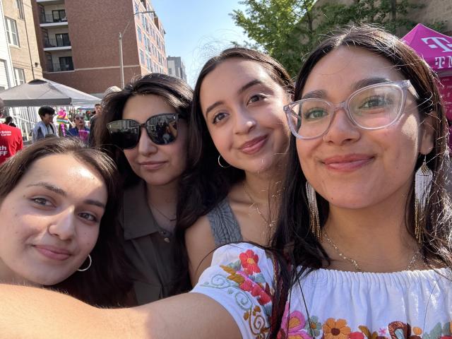 Group photo of Lizbeth and friends at a carnival.