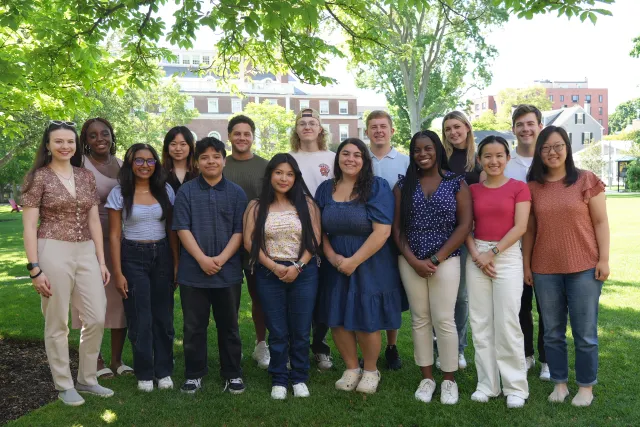 Student Interns posed on the grass of Radcliffe Institute.