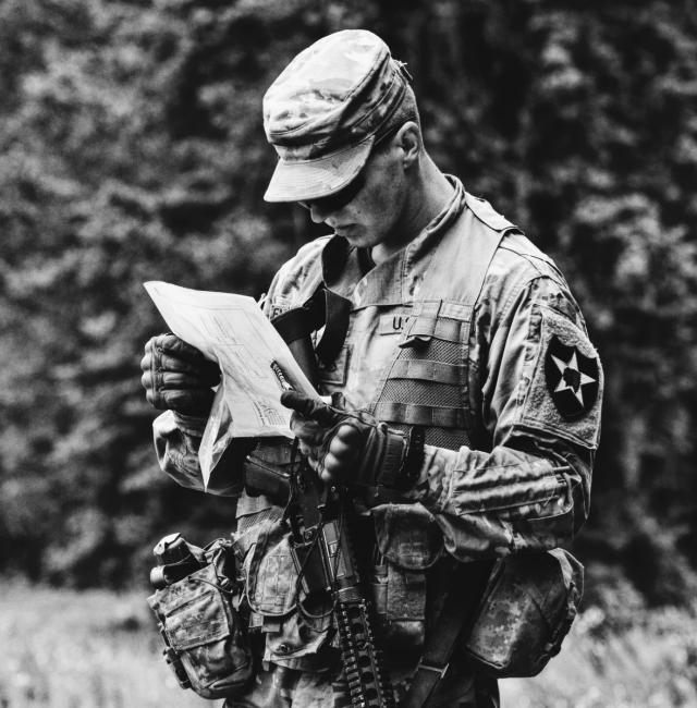 Soldier analyzes paper