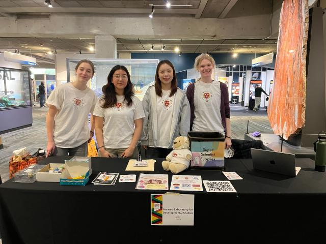 4 researchers at Harvard LDS at a participant recruitment event at the Museum of Science!