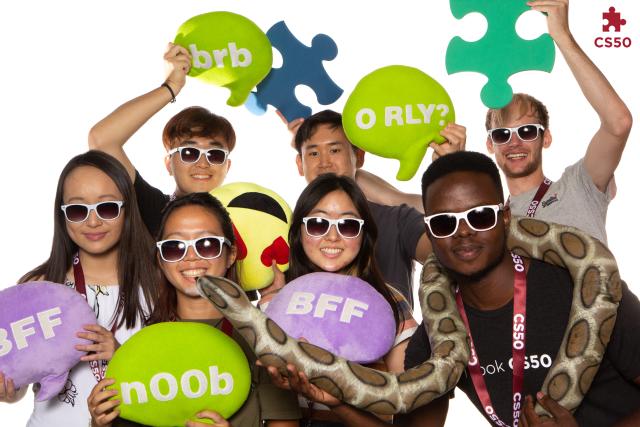 Photo booth photo of Inno and other staff cohort members at the fall 2022 Puzzle Day.