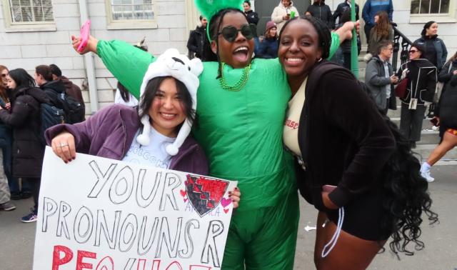 3 girls happily posing in Harvard Yard during Housing Day 2025. 