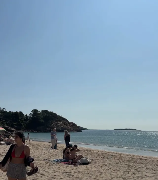 Beach with girl in corner of photo