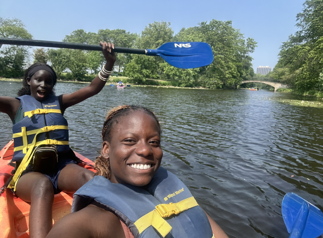 My co-worker Nyankiir and I kayak down the Charles River.