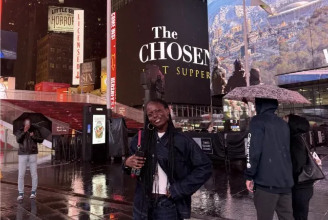 I smile for a photo at Times Square in New York City.