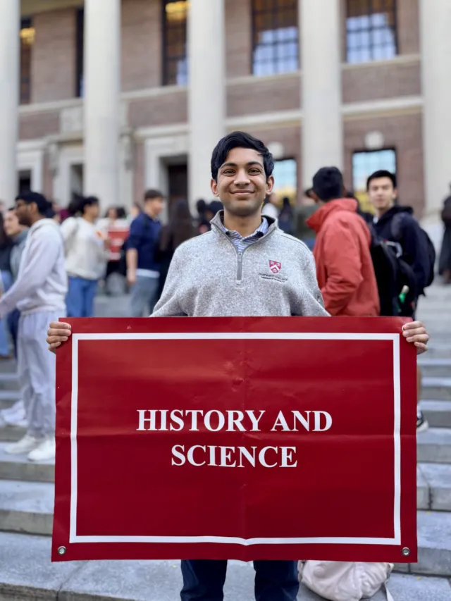 I pose with the sign for History and Science in front of Widener Library