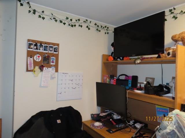 A desk set-up with a monitor and TV. 