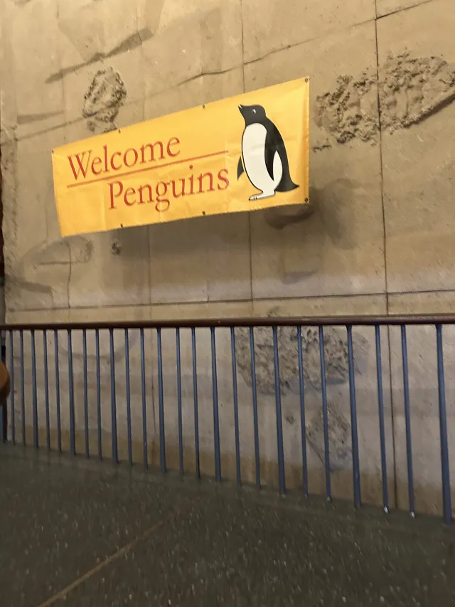 A sign saying "Welcome Penguins" as you walk up the stairs to the Quincy House Dining Hall