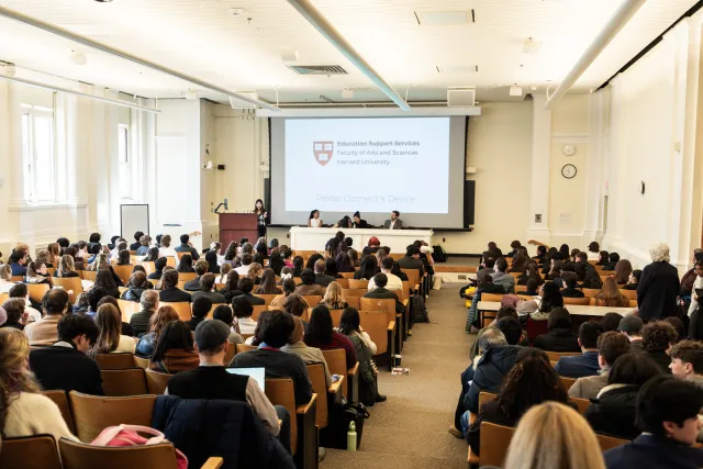 Students seated in large full lecture hall 