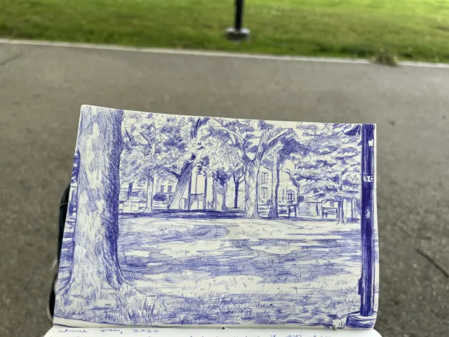 Sketch of a park environment in blue ink on a notepad. 
