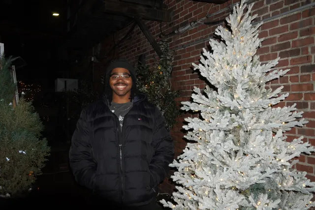 Me standing next to a white tree