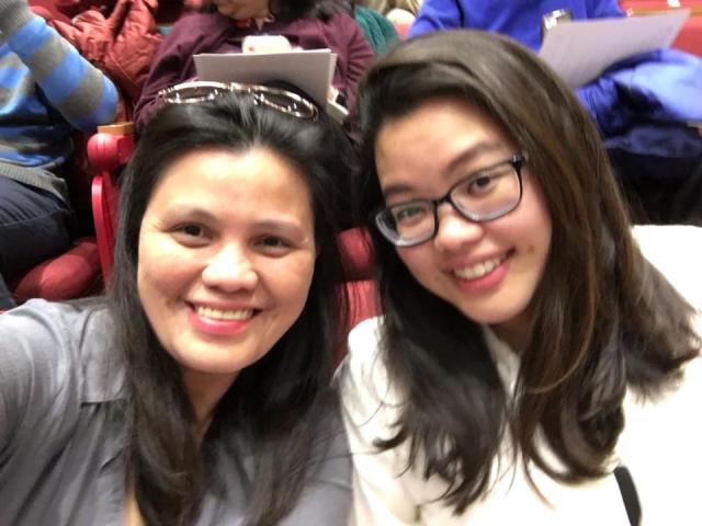 student and parent in a lecture hall