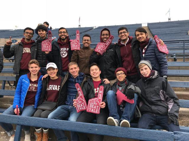 Students cheering at Harvard-Yale football game