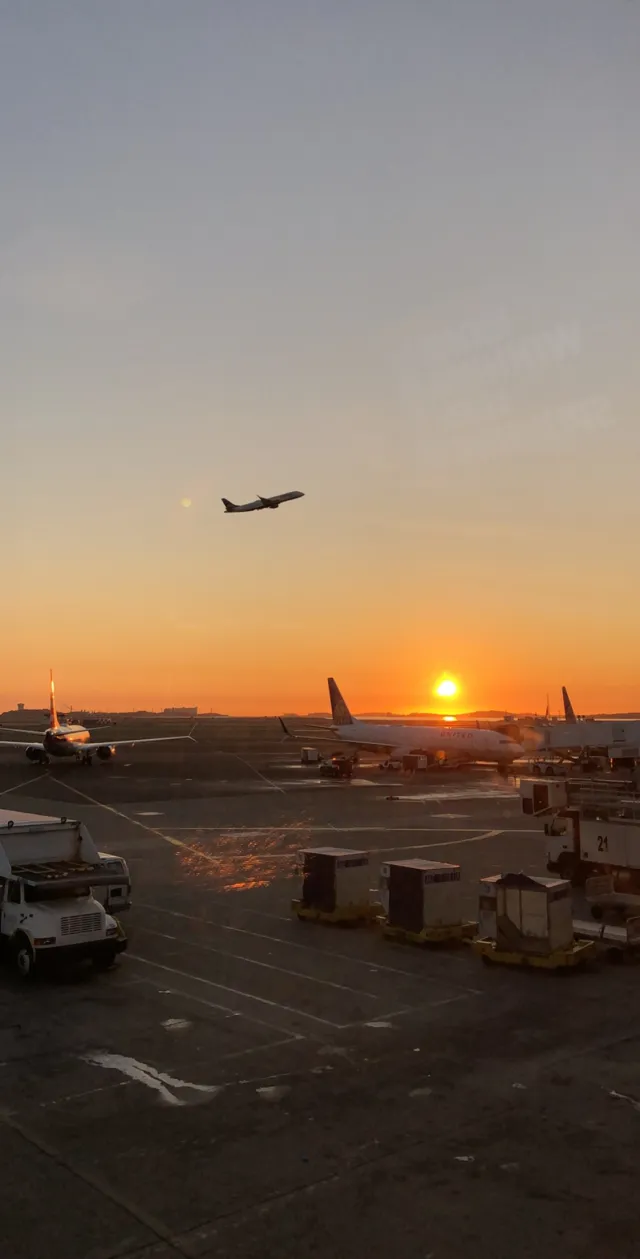 Image of plan taking off during the sunrise. 