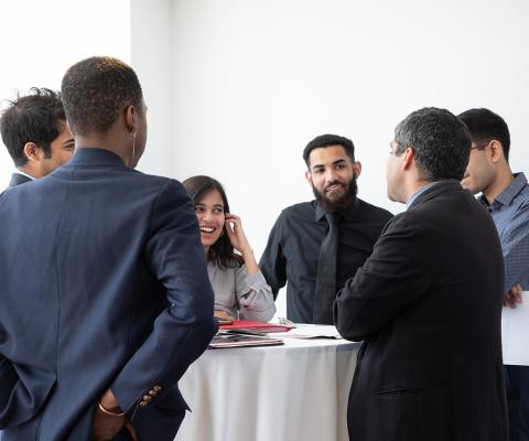 Dean Khurana and students talking at the Advising Awards ceremony