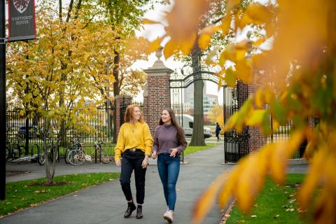 Two female students walking outside of Winthrop House