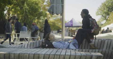 2 students talking and hanging out in Science Center Plaza