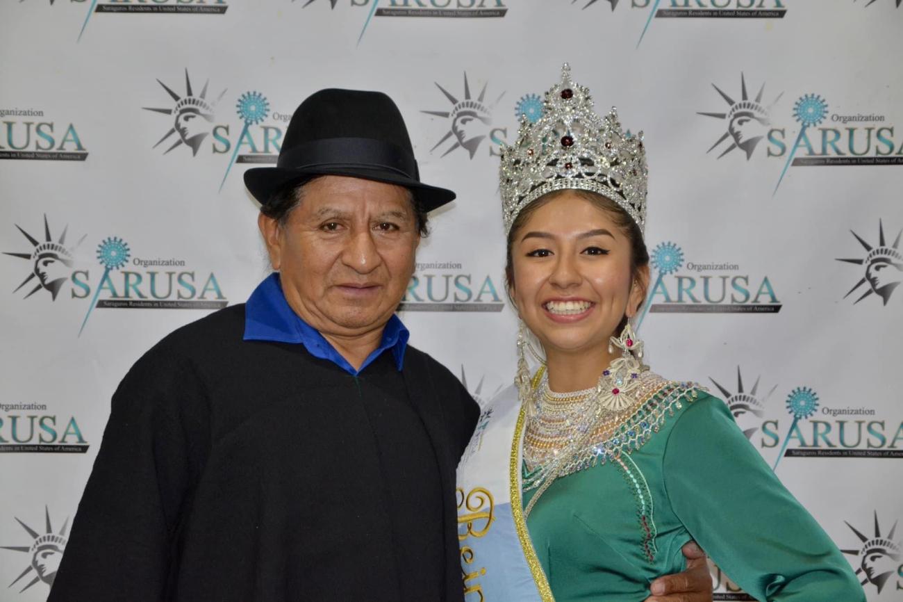 Writer in a crown posing with her grandfather